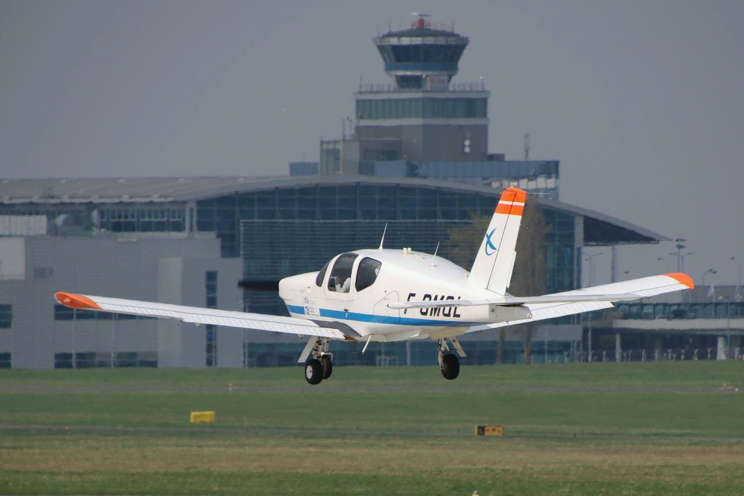 A TB20 seen landing on a runway